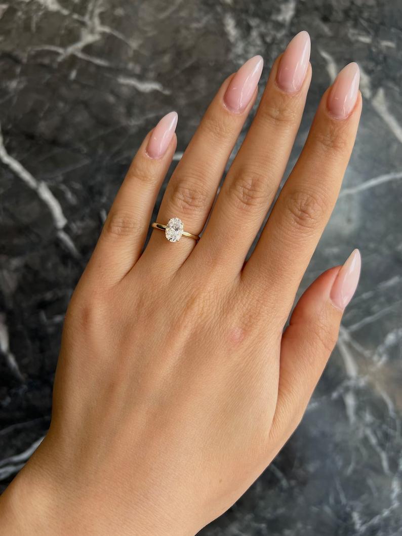 Oval three-stone engagement ring, Oval side stone engagement ring, Oval cathedral engagement ring, Oval bezel engagement ring, Oval tension set engagement ring, Oval split shank engagement ring, Oval channel set engagement ring, 