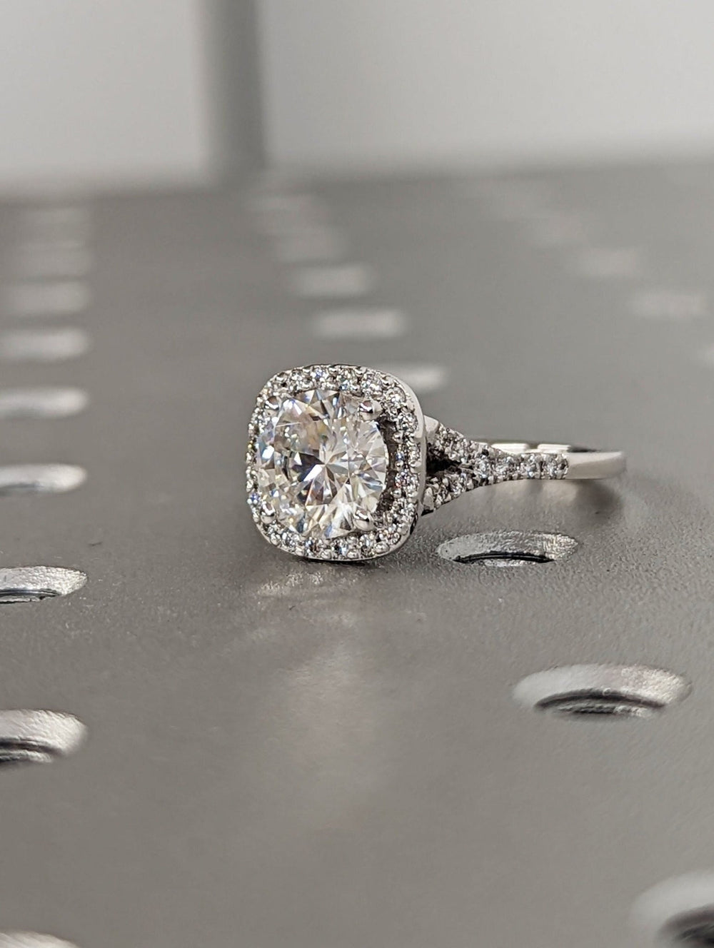 round cut halo diamond ring with pave band