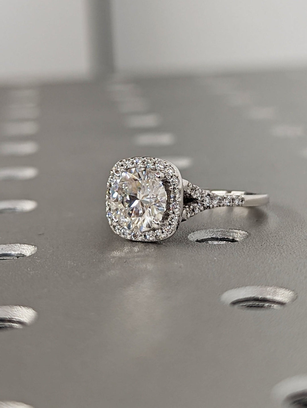 round cut halo diamond ring with pave band