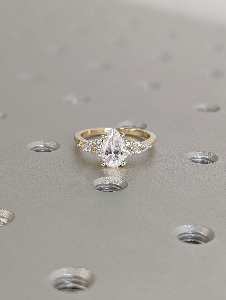 pear cut cluster diamond ring,