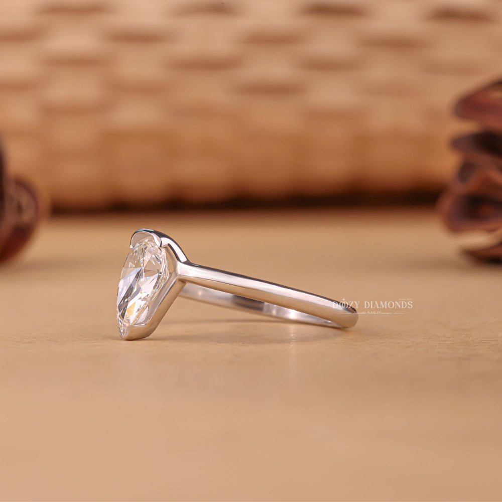 Pear classic diamond ring, Pear modern diamond ring, Pear three-stone diamond ring, Pear side stone diamond ring, Pear cathedral diamond ring, Pear bezel diamond ring,