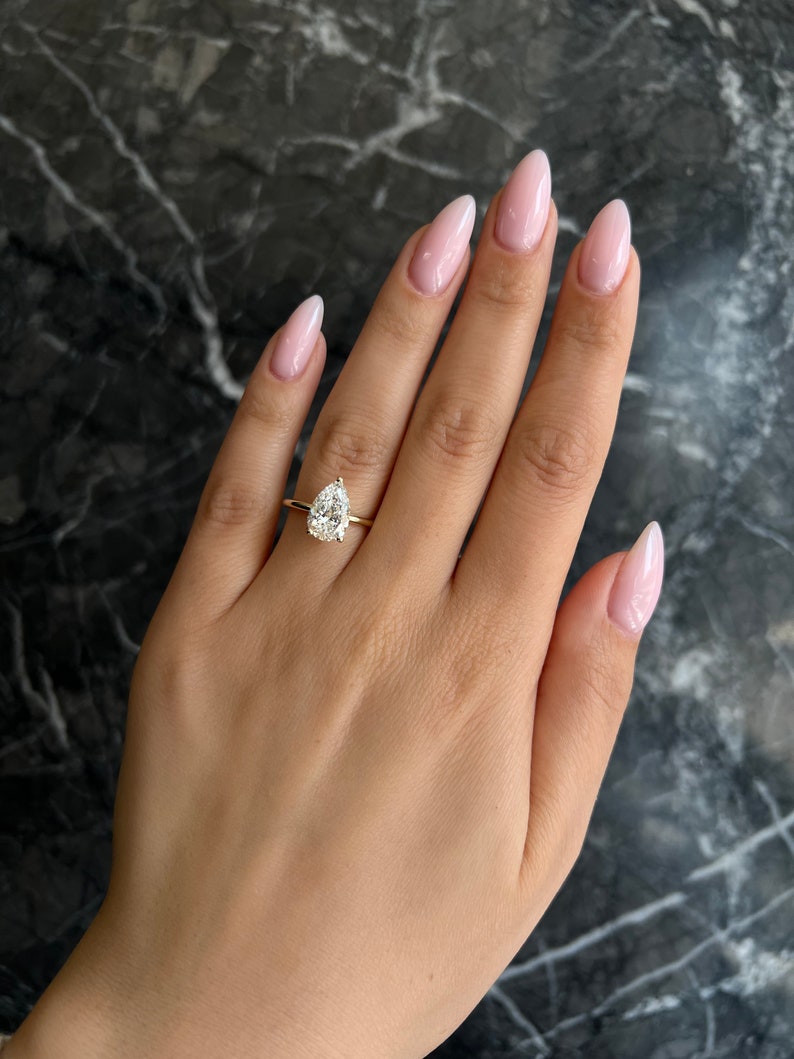 Pear classic diamond ring, Pear modern diamond ring, Pear three-stone diamond ring, Pear side stone diamond ring, Pear cathedral diamond ring, Pear bezel diamond ring, Pear tension set diamond ring, Pear split shank diamond ring, Pear channel set diamond ring, 