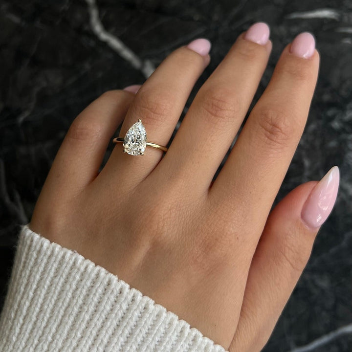 Pear swirl diamond ring, Pear unique diamond ring, Pear traditional diamond ring, Pear contemporary diamond ring, Pear minimalist diamond ring, Pear intricate diamond ring, Pear bold diamond ring, Pear delicate diamond ring,