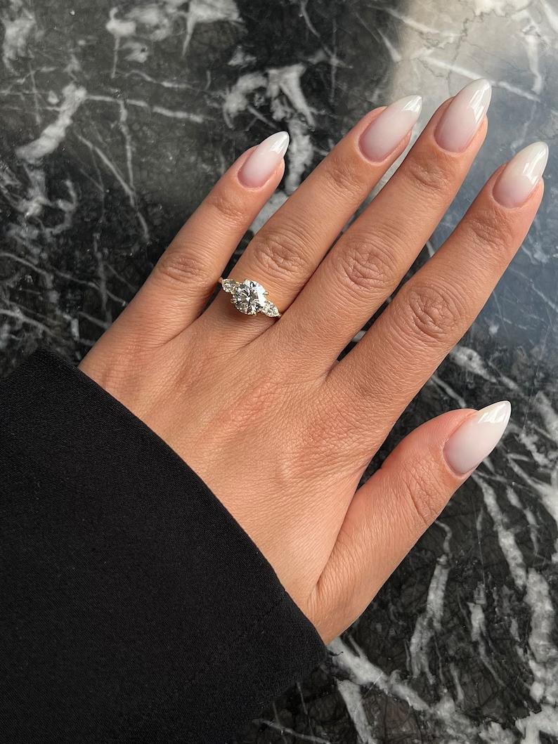 Buy three-stone engagement ring, Best three-stone engagement ring, Three-stone engagement ring for sale, Affordable three-stone diamond rings, Shop three-stone engagement rings, Three-stone ring price, Custom three-stone engagement rings, 