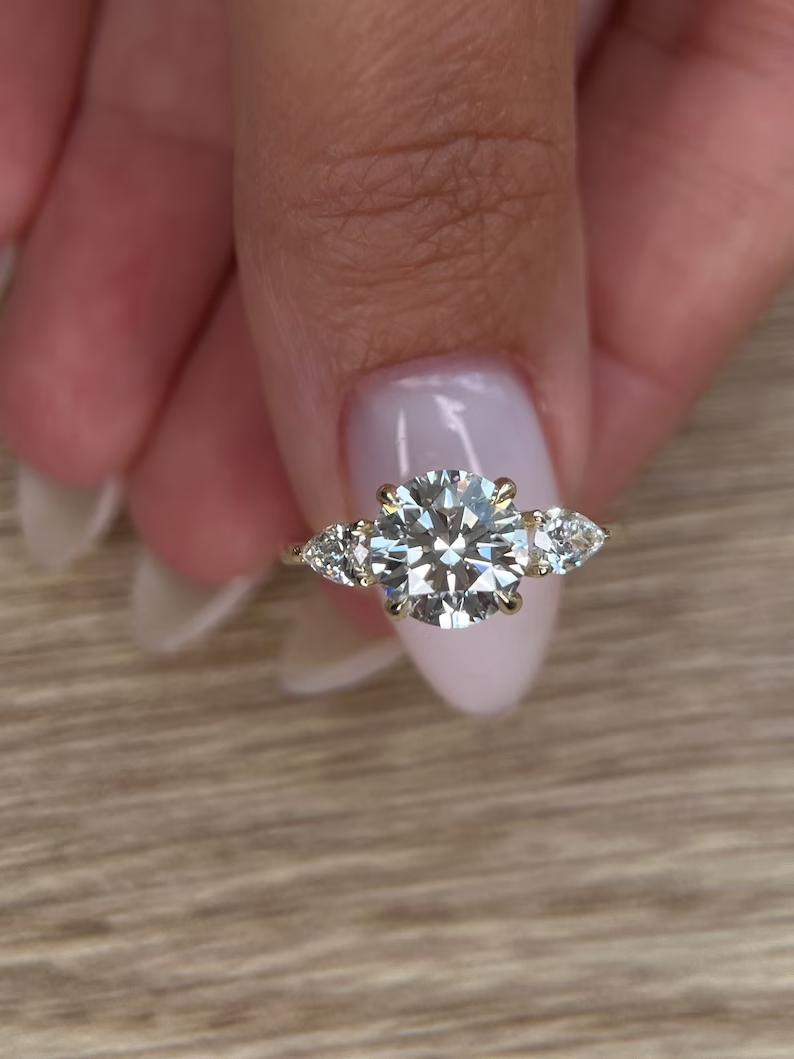  Three-stone diamond ring near me, Three-stone rings with financing, Three-stone moissanite engagement ring, Three-stone ring in 14K gold, Buy princess cut three-stone ring, 