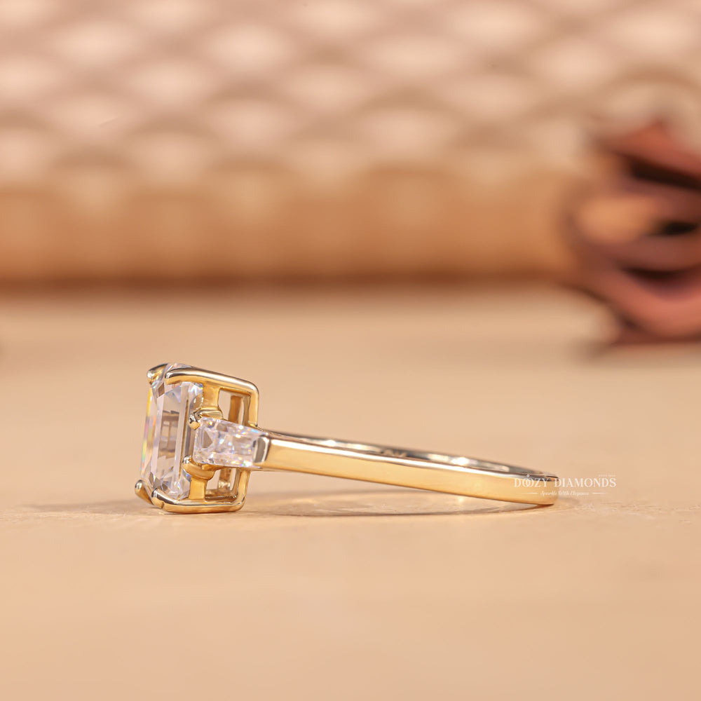 handcrafted engagement ring, emerald center stone ring, side stone engagement ring, past present future ring, statement engagement ring, timeless engagement ring, elegant diamond ring,