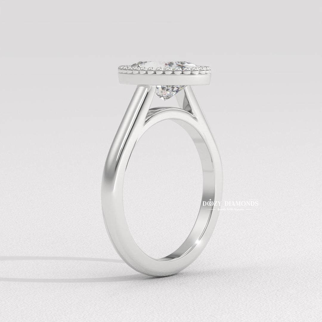 Eco-Conscious Antique Style Ring
22. Sculptural Vintage Bezel Setting
23. Elongated Oval Bezel Engagement Ring