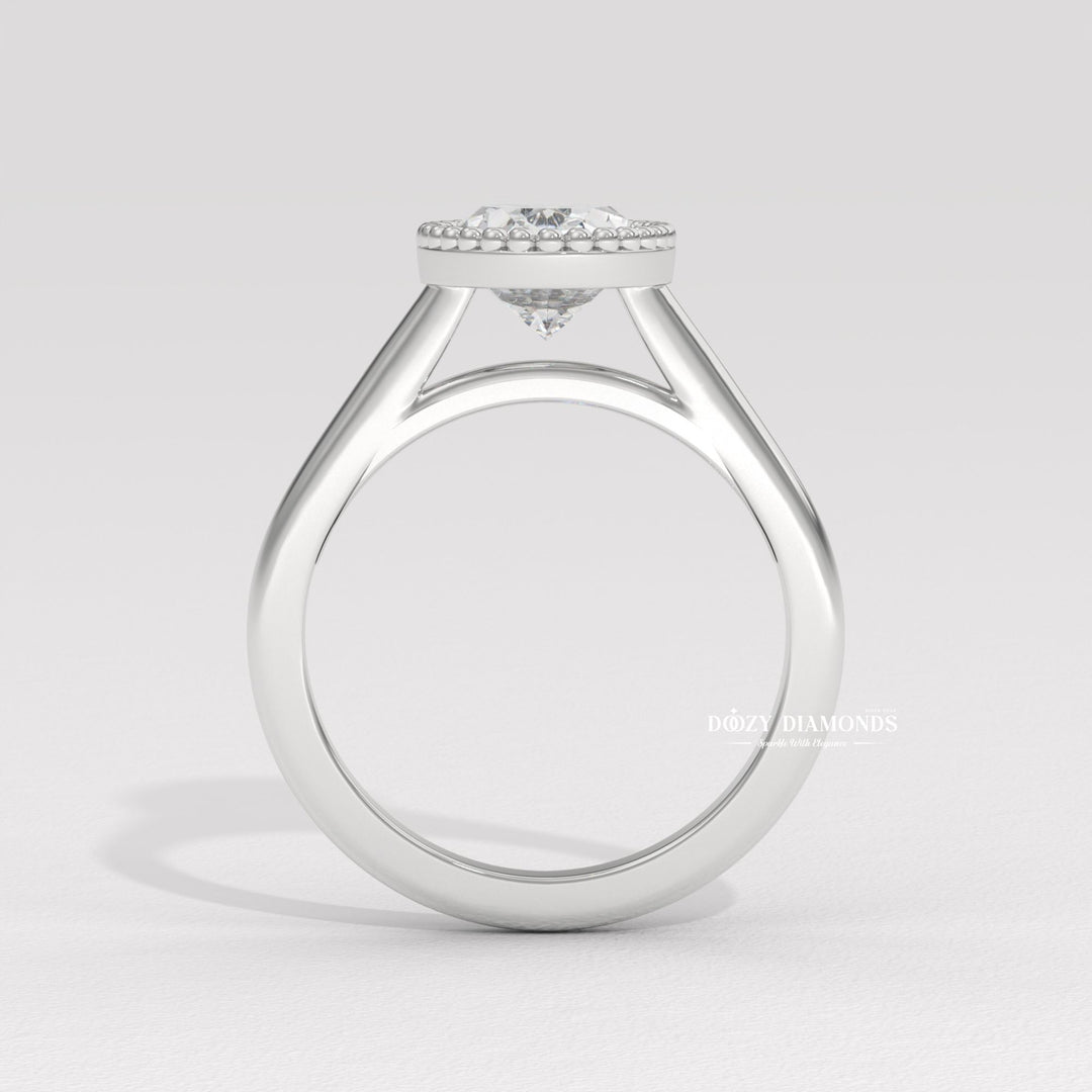 22. Sculptural Vintage Bezel Setting
23. Elongated Oval Bezel Engagement Ring
24. Recycled Gold Vintage Bezel Ring