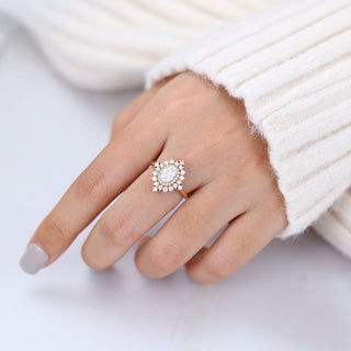 oval-shaped-moissanite-cluster-halo-engagement-ring