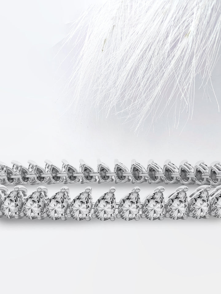 Pear Cut Moissanite Diamond Bezel Set Tennis Bracelet In 14K Rose Gold