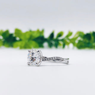 round-cut-solitaire-twisted-pave-moissanite-engagement-ring