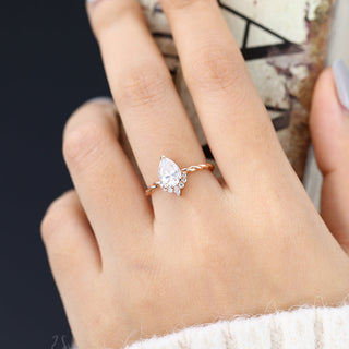 0-90-ct-pear-shaped-moissanite-cluster-engagement-ring