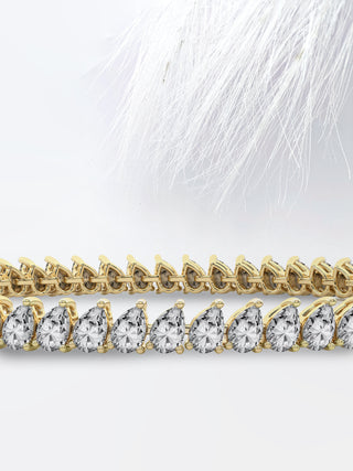 Pear Cut Moissanite Diamond Bezel Set Tennis Bracelet In 14K Rose Gold
