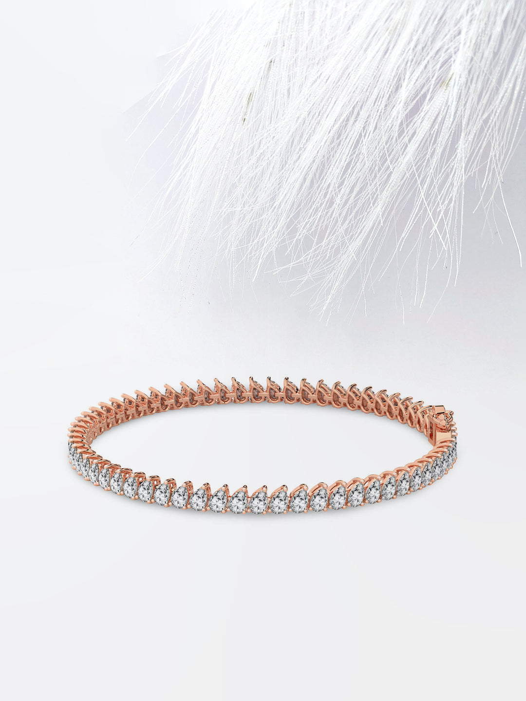 Pear Cut Moissanite Diamond Bezel Set Tennis Bracelet In 14K Rose Gold