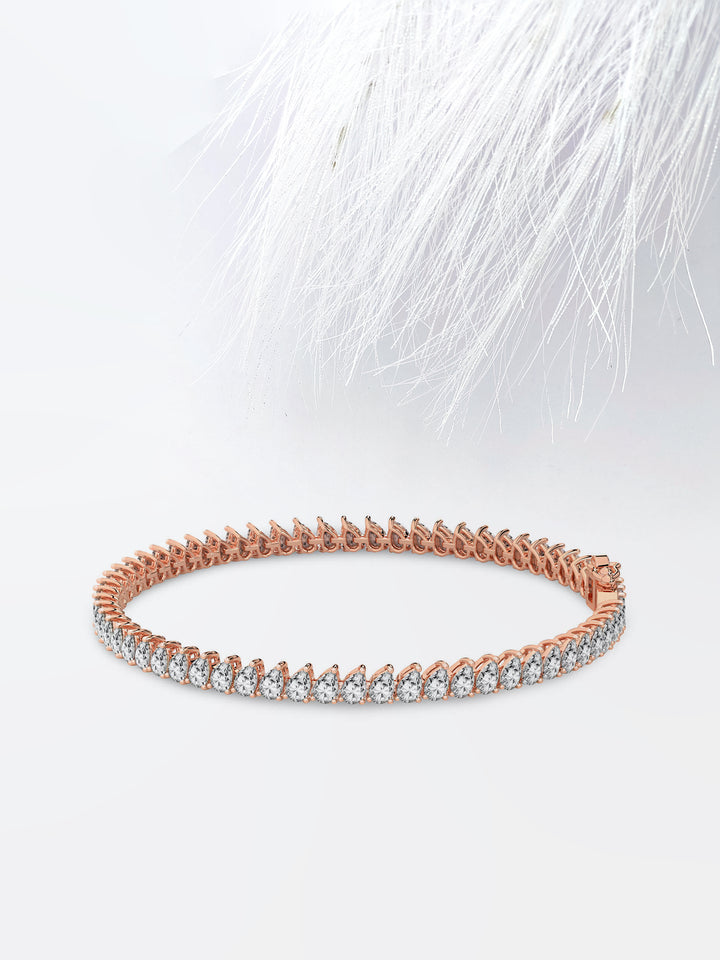Pear Cut Moissanite Diamond Bezel Set Tennis Bracelet In 14K Rose Gold