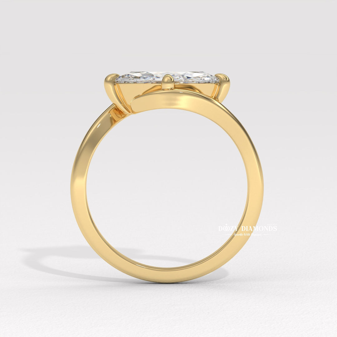 8. Architectural Bypass Ring Design
9. Sleek East West Bypass Ring
10. Minimalist Marquise East West Ring
11. Sculptural Bypass Engagement Ring