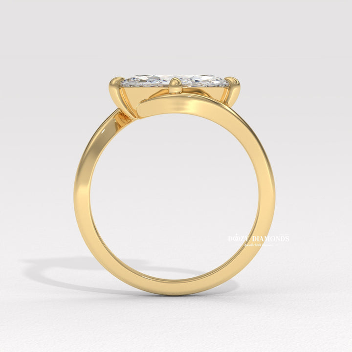 8. Architectural Bypass Ring Design
9. Sleek East West Bypass Ring
10. Minimalist Marquise East West Ring
11. Sculptural Bypass Engagement Ring