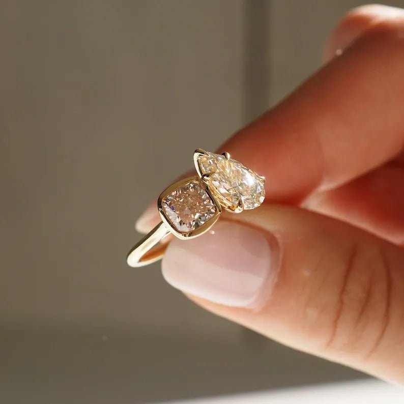 modern luxury ring, elegant bridal ring, designer toi et moi ring, cushion statement ring, pear statement ring, sophisticated bridal ring, contemporary luxury ring, unique proposal ring, luxury love ring.