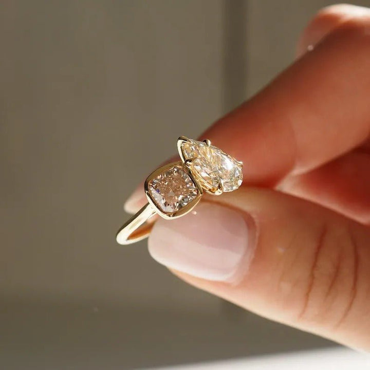 modern luxury ring, elegant bridal ring, designer toi et moi ring, cushion statement ring, pear statement ring, sophisticated bridal ring, contemporary luxury ring, unique proposal ring, luxury love ring.