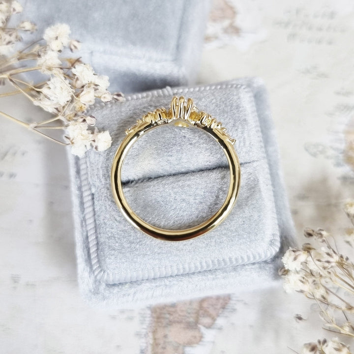 Pear cut engagement ring shown with authenticity certificate