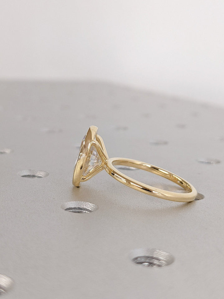Elegant oval bezel set diamond ring for women