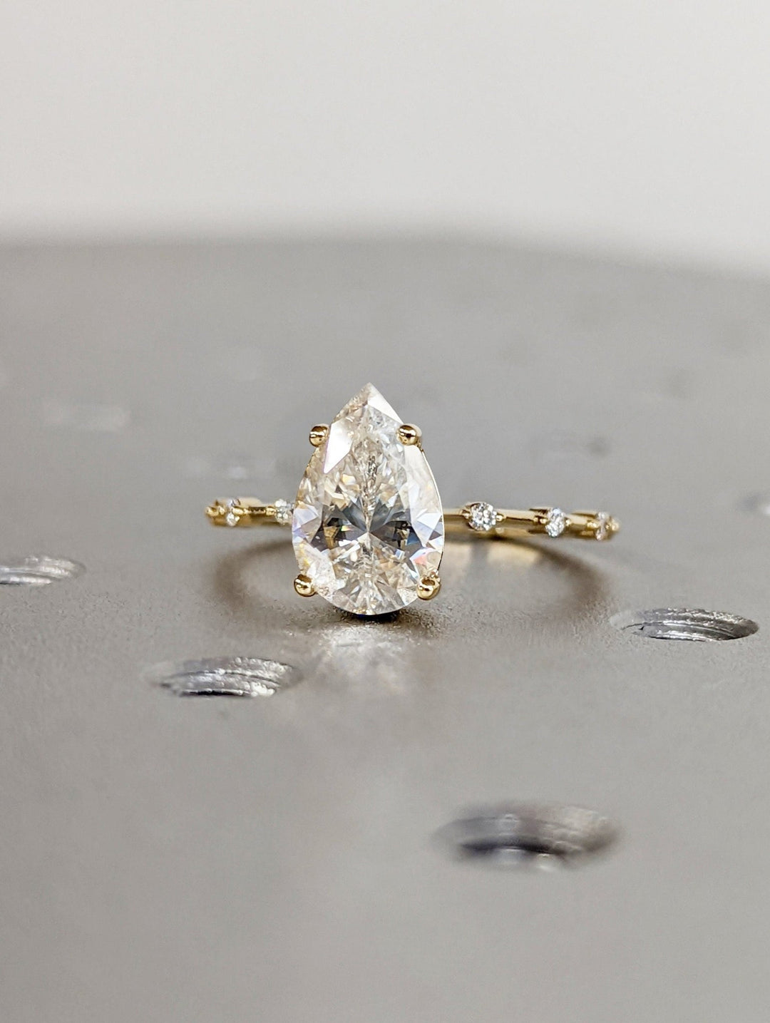 Lab grown diamond engagement ring featuring pear center stone