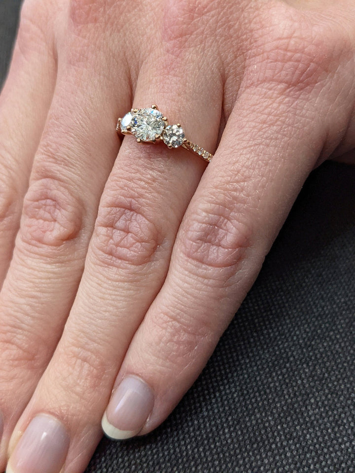 featuring three stone setting