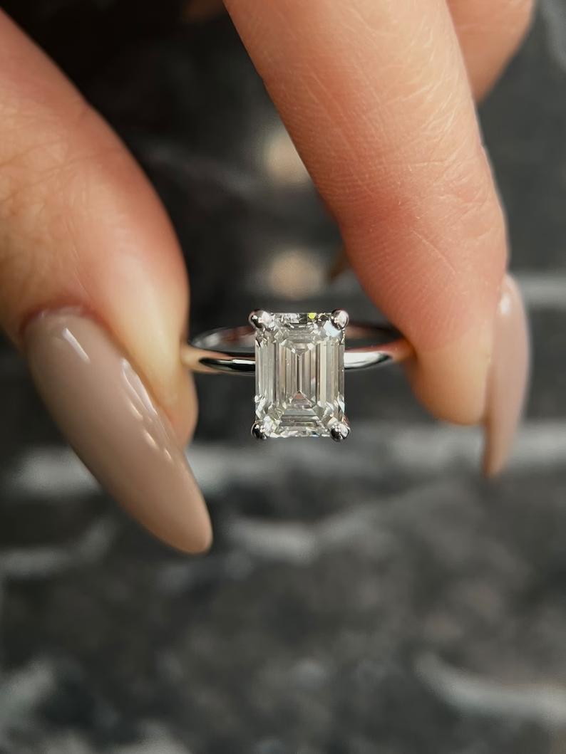 Emerald unique engagement ring, Emerald traditional engagement ring, Emerald contemporary engagement ring, Emerald minimalist engagement ring, Emerald intricate engagement ring, Emerald bold engagement ring, Emerald delicate engagement ring, Emerald timeless engagement ring, Emerald elegant engagement ring,