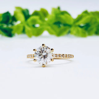 round-cut-solitaire-pave-moissanite-engagement-ring