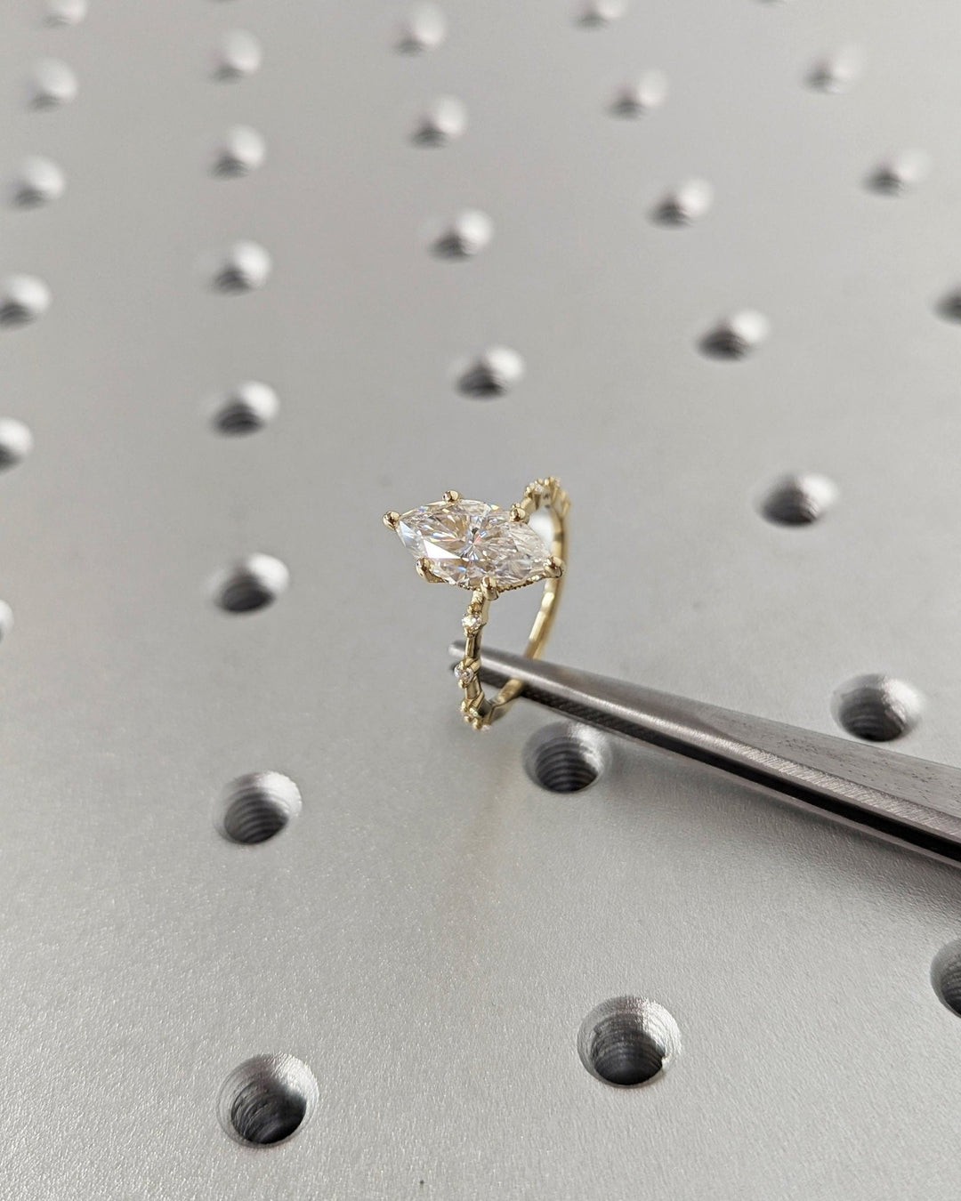 Brilliant marquise diamond ring with petite pave detailing