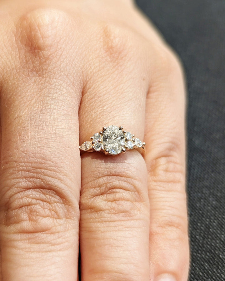 Brilliant oval cluster lab diamond engagement ring close up