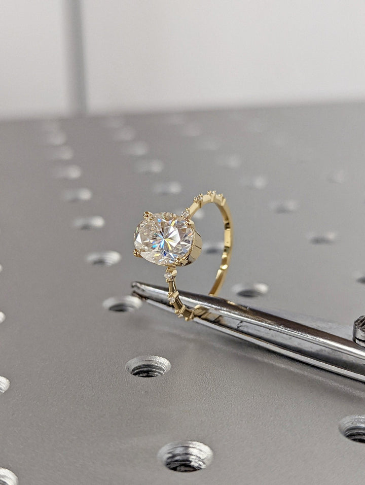 Lab grown diamond ring featuring oval center stone