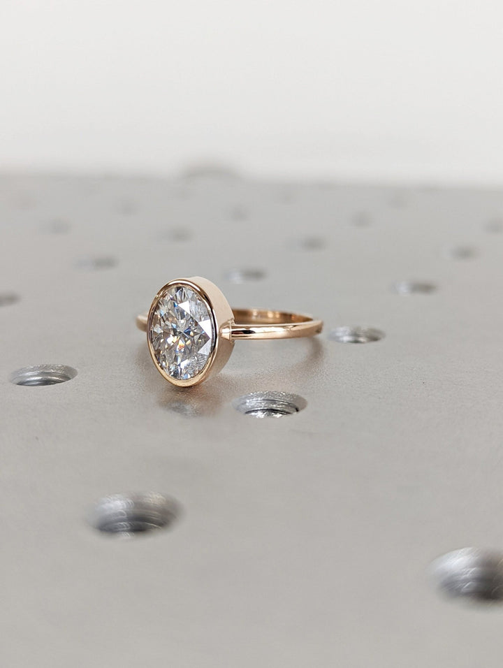 Contemporary bezel set engagement ring for women
