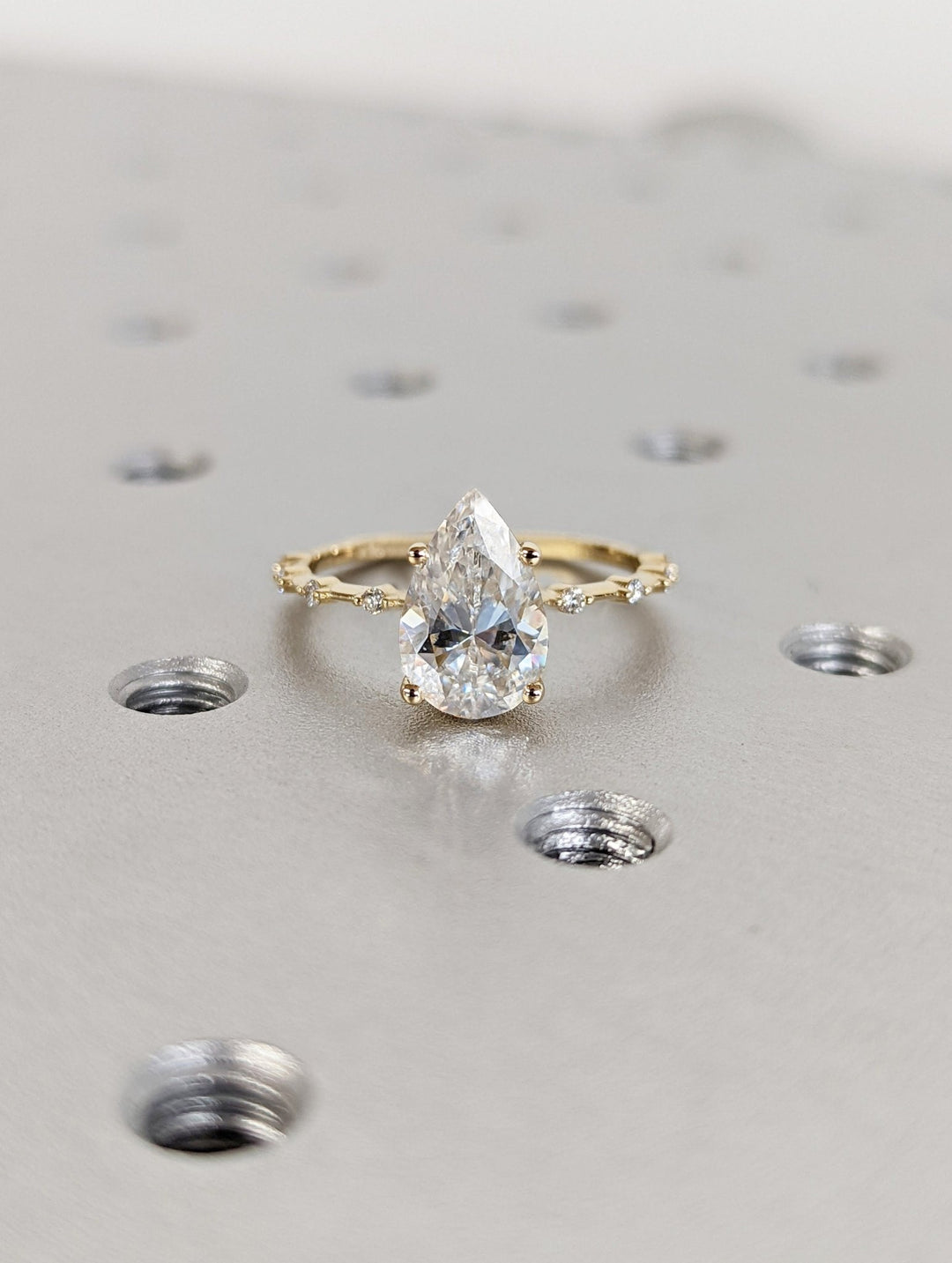 Brilliant pear shaped lab diamond ring with petite pave accents