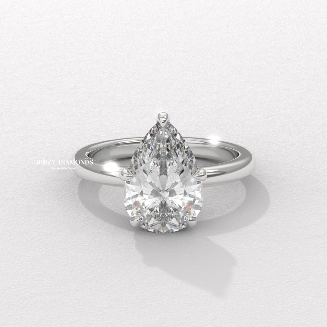 Low profile pear shaped engagement ring
Hidden halo pear diamond ring
Solitaire pear cut diamond ring
Unique pear shaped engagement ring
Platinum pear shaped solitaire ring
18k gold pear cut diamond ring