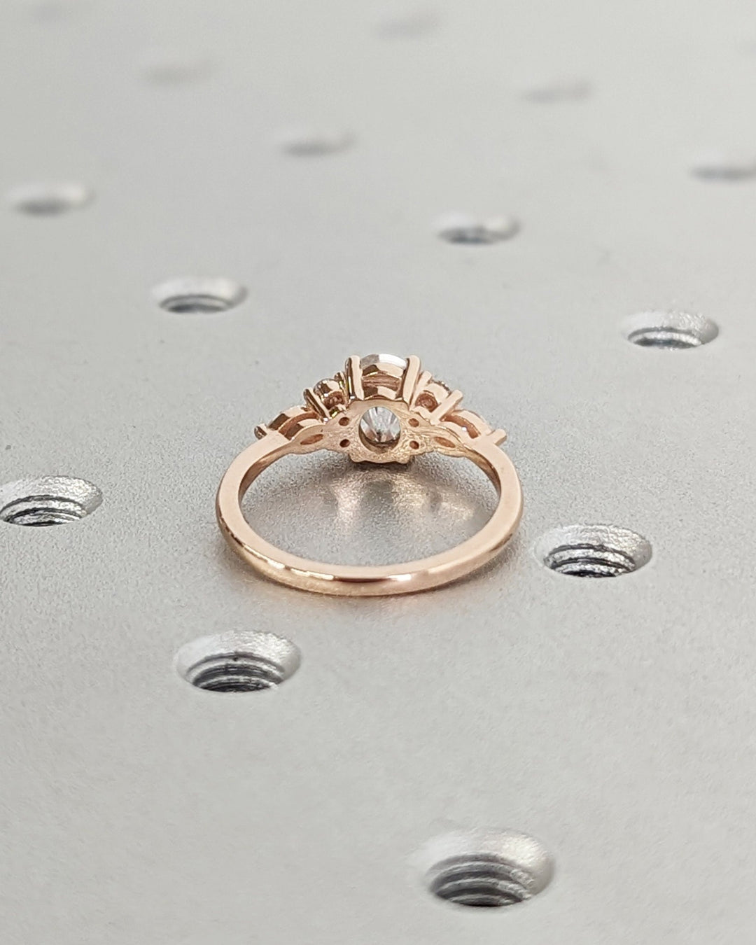 Lab grown diamond engagement ring featuring oval cluster setting