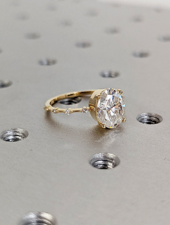 Statement oval bridal ring with petite pave band