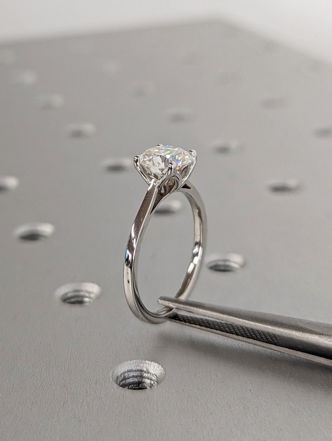 Sophisticated proposal ring with round center diamond