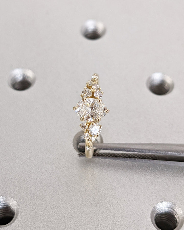 Sophisticated oval diamond proposal ring with botanical design