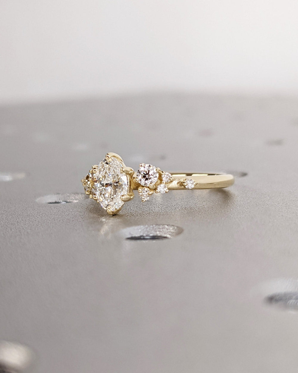 Elegant oval cluster diamond engagement ring with floral details