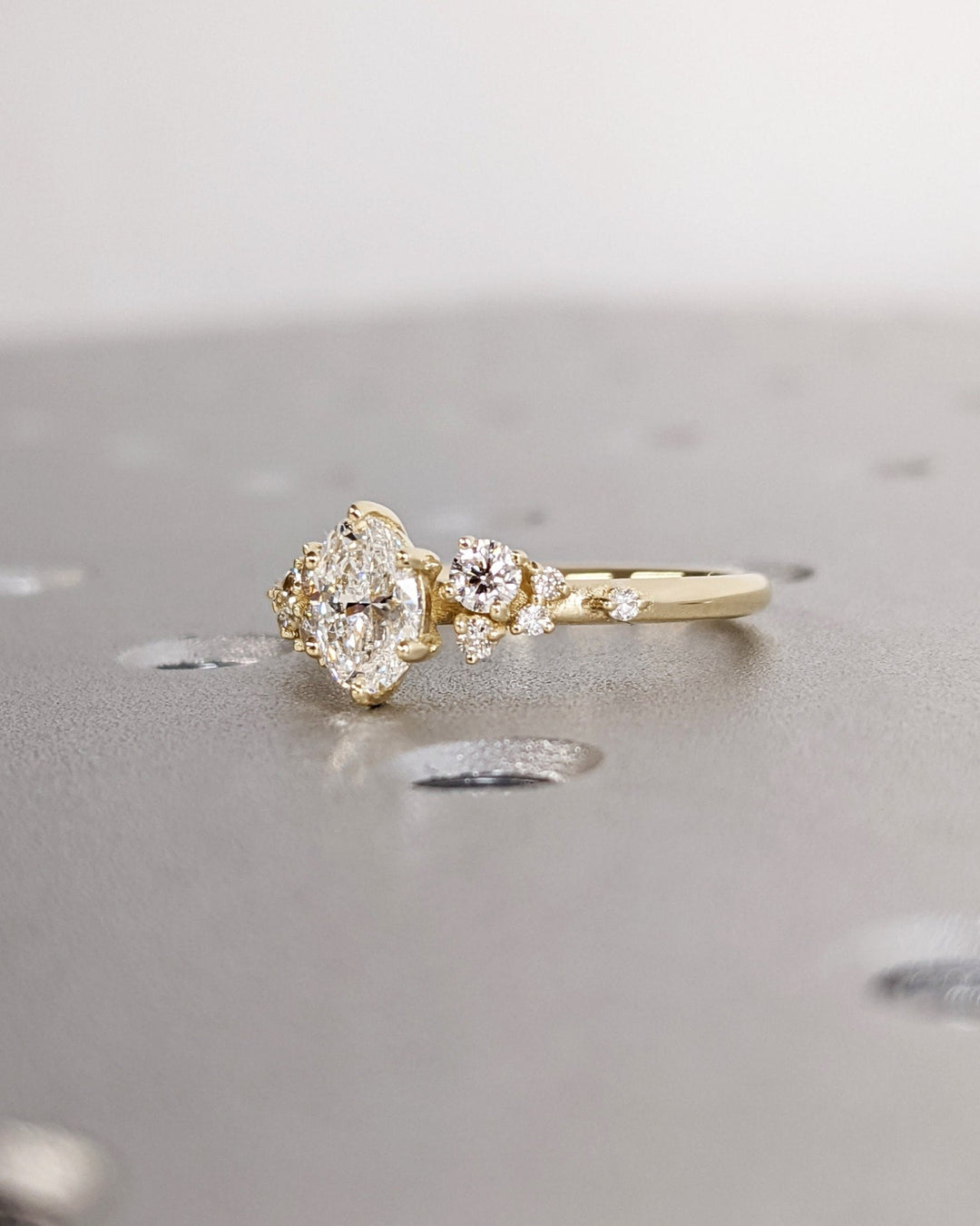 Elegant oval cluster diamond engagement ring with floral details
