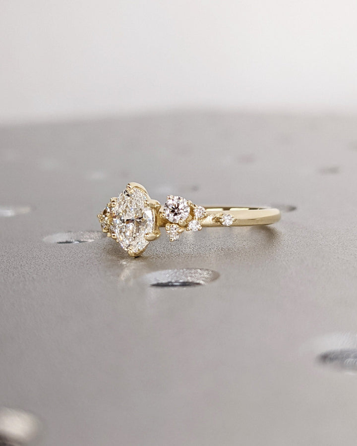Elegant oval cluster diamond engagement ring with floral details