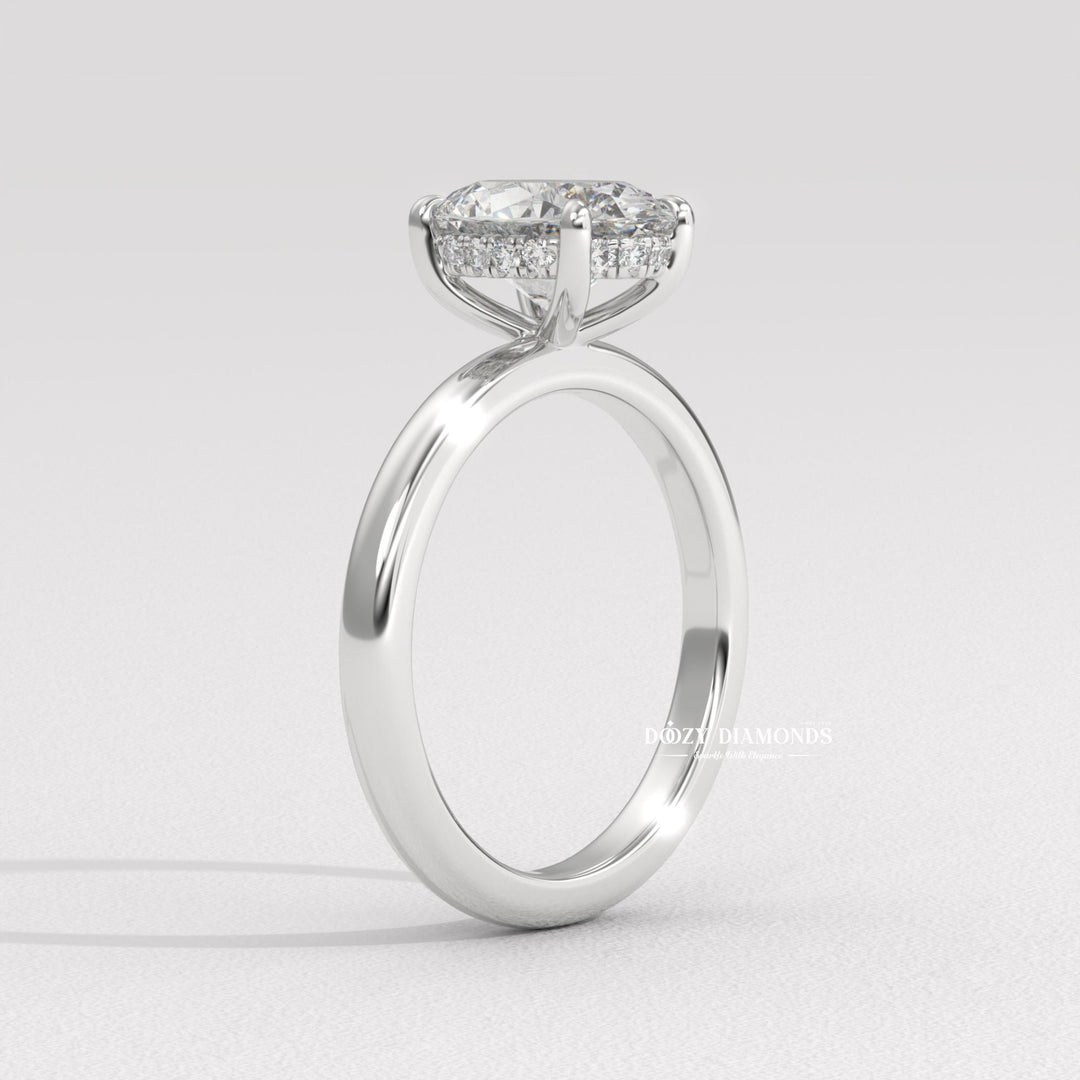 Oval diamond ring
Hidden halo engagement ring
Oval solitaire with hidden halo
Modern oval engagement ring
Classic oval yellow gold ring
Minimalist yellow gold ring
