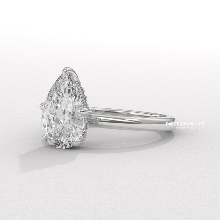 18k gold pear cut diamond ring
Timeless pear shaped engagement ring
Sparkling hidden halo diamond ring
Pear cut solitaire engagement ring