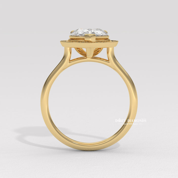Pear shaped diamond halo setting
Pear cut white gold engagement ring
Pear cut rose gold halo ring
Pear diamond ring with side stones