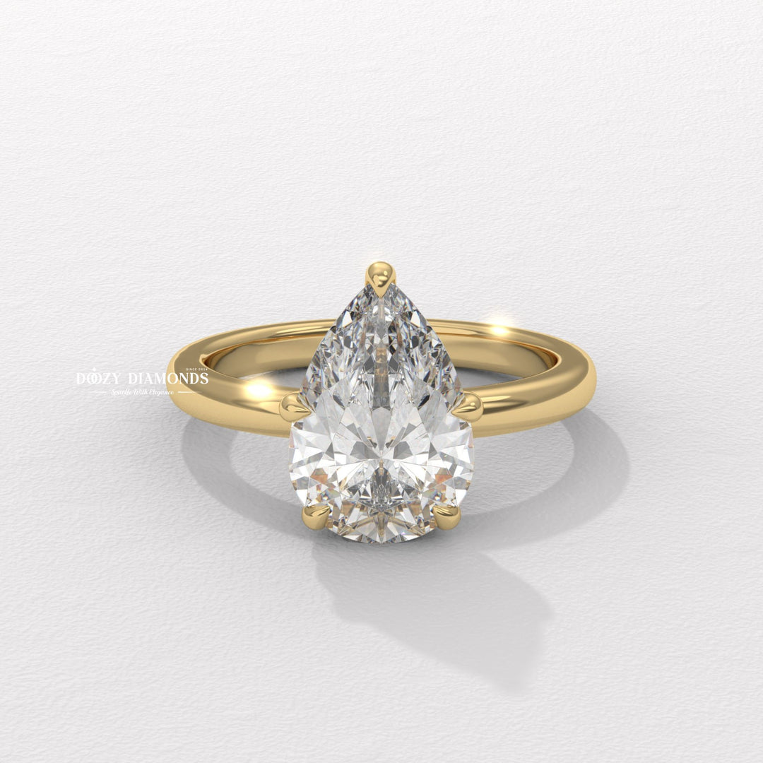 Hidden halo pear cut diamond ring
Pear shaped diamond solitaire ring
Elegant pear cut engagement ring
Hidden halo solitaire engagement ring
Pear shaped diamond ring with hidden halo
Teardrop diamond solitaire ring
