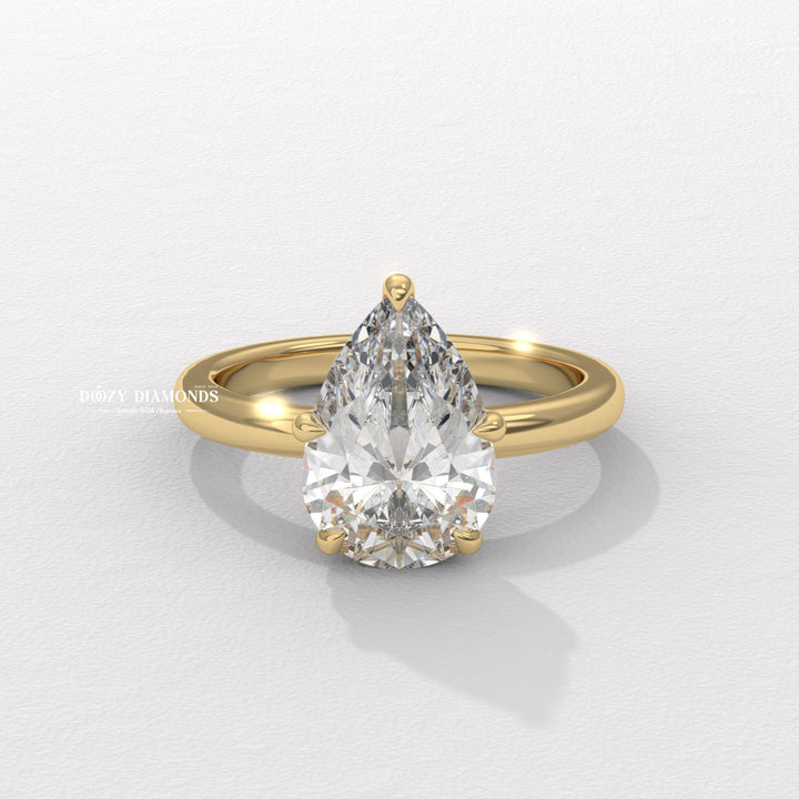 Hidden halo pear cut diamond ring
Pear shaped diamond solitaire ring
Elegant pear cut engagement ring
Hidden halo solitaire engagement ring
Pear shaped diamond ring with hidden halo
Teardrop diamond solitaire ring