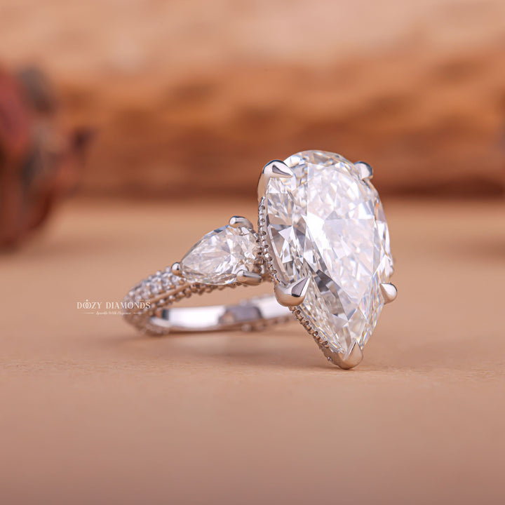 Pear split shank diamond ring, Pear channel set diamond ring, Pear swirl diamond ring, Pear unique diamond ring, Pear traditional diamond ring, Pear contemporary diamond ring,