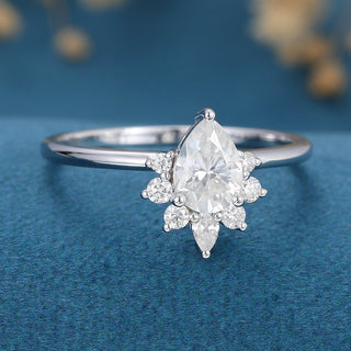 0-69-ct-pear-shaped-moissanite-cluster-engagement-ring-4