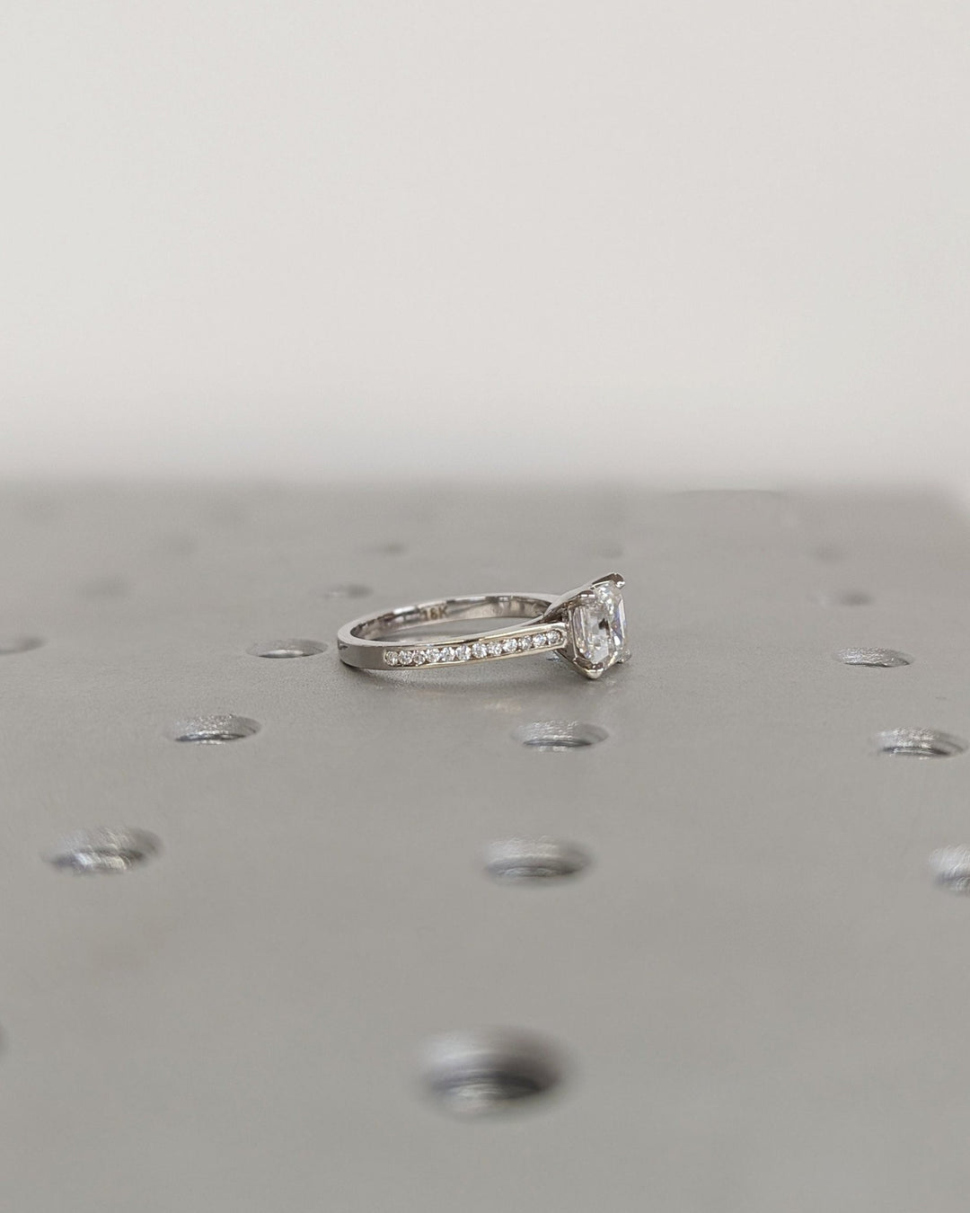 Sparkling asscher cut engagement ring with sleek channel setting
